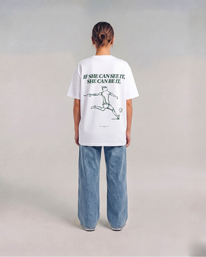 Model wearing the back of the white SHE CAN Tee by KS Label
