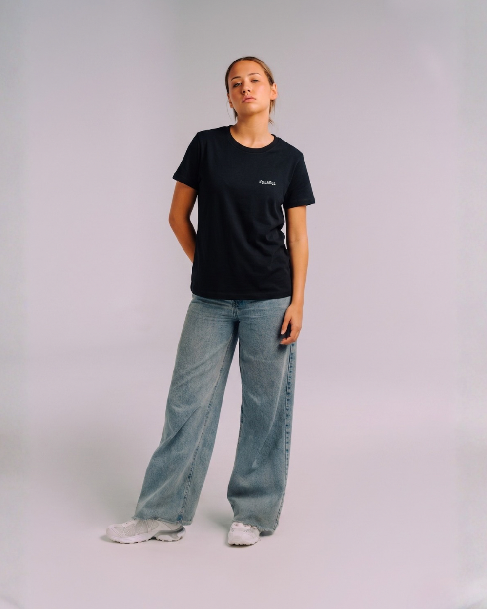 Model wearing her era essential black ks label