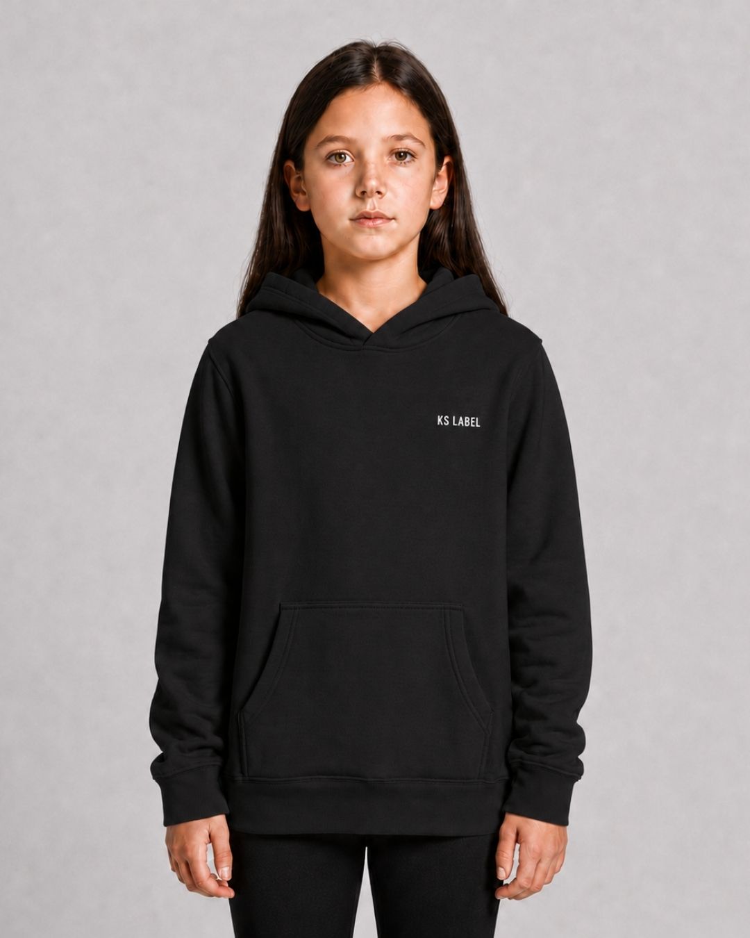 SHE_CAN_Youth_Hood_in_Black_Flatlay_Model_Front
