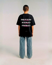 Model wearing the back of the black HER ERA OVERSIZED tee by KS Label