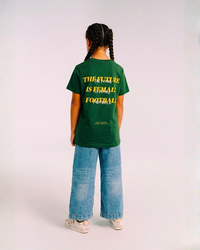 Model wearing the back of the green Her Era Statement Youth tee by KS Label