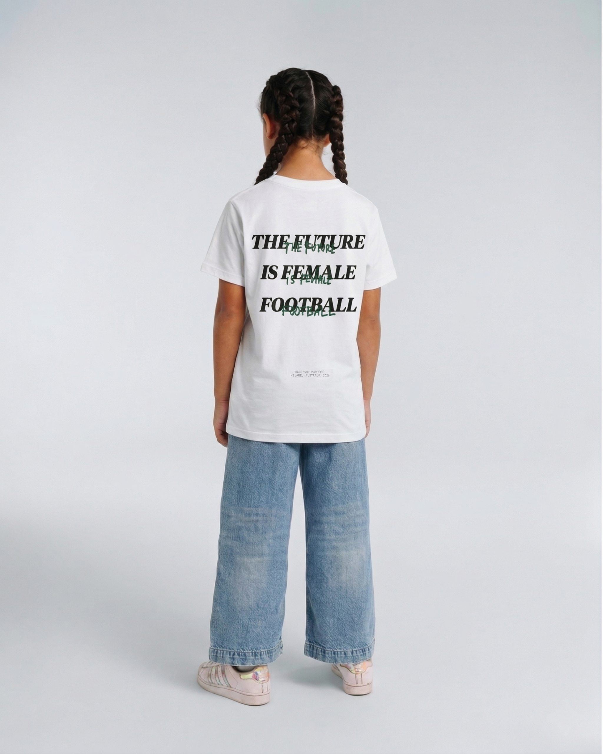 Model wearing the back of the white Her Era Statement Youth tee by KS Label